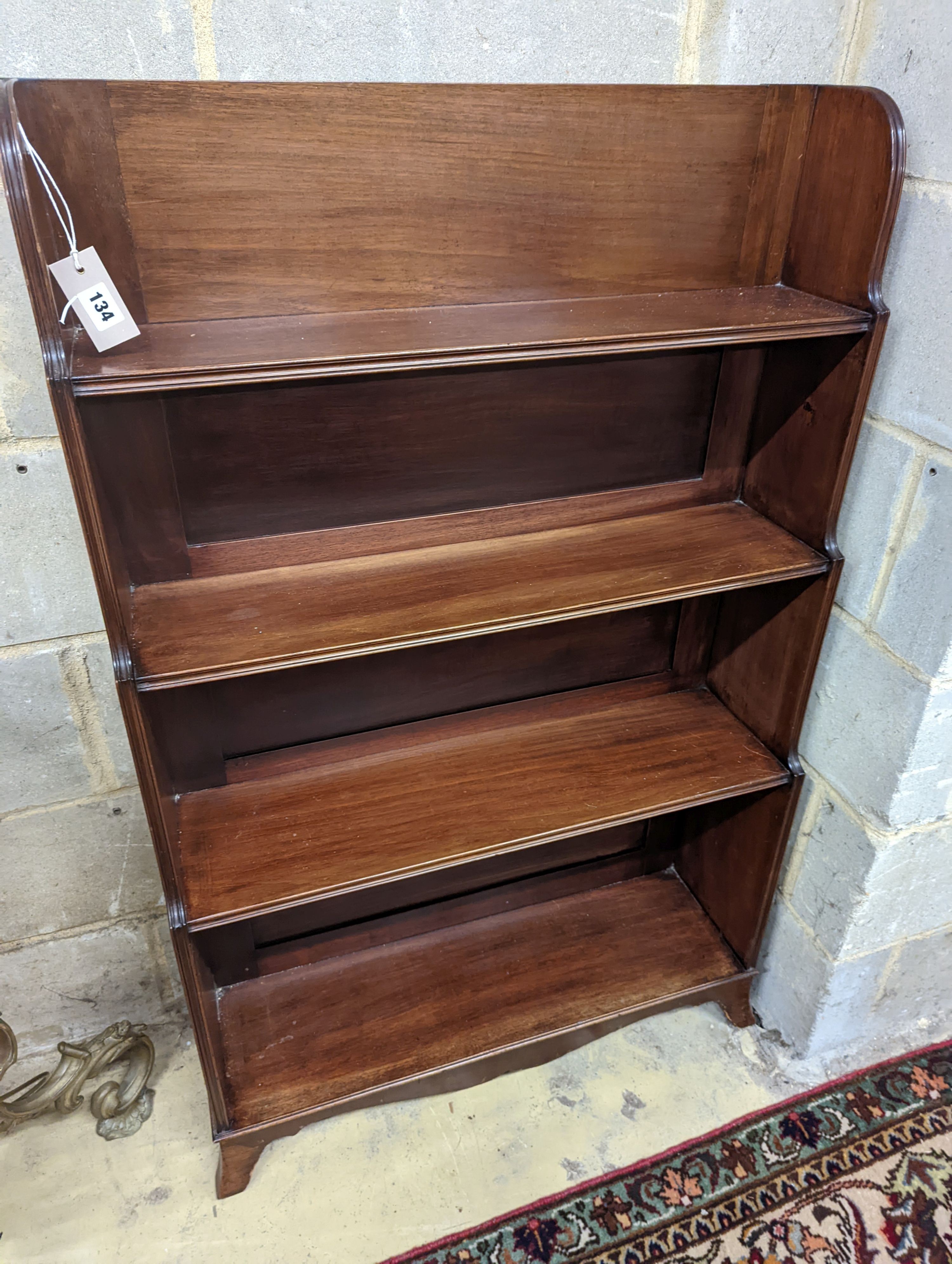 A George III style mahogany graduated open bookcase, width 77cm, depth 25cm, height 122cm